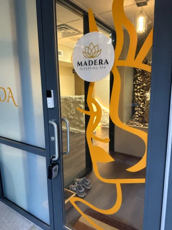 Madera Spa entrance with gold details and natural tones